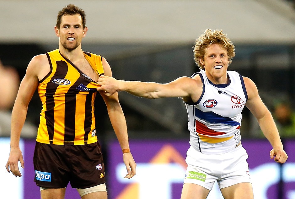 AFL 2015 Second Semi Final - Hawthorn v Adelaide MELBOURNE, AUSTRALIA - SEPTEMBER 18: Luke Hodge of the Hawks and Rory Sloane of the Crows wrestle during the 2015 AFL Second Semi Final match between the Hawthorn Hawks and the Adelaide Crows at the Melbourne Cricket Ground, Melbourne, Australia on September 18, 2015. (Photo by Justine Walker/AFL Media)